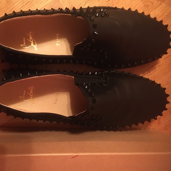 Christian Louboutin black Pik Boat Studded slip on sneakers in a size 14 US.